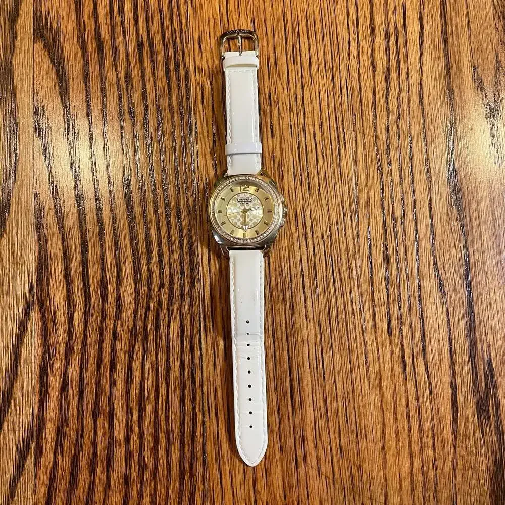 Coach Boyfriend Gold Tone Crystal Bezel Watch with White Strap